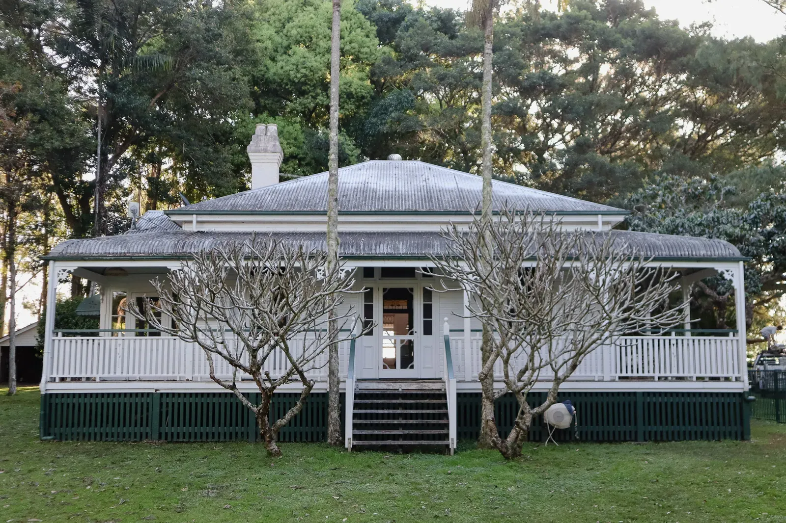The weatherboard homestead frontage with its wraparound verandah